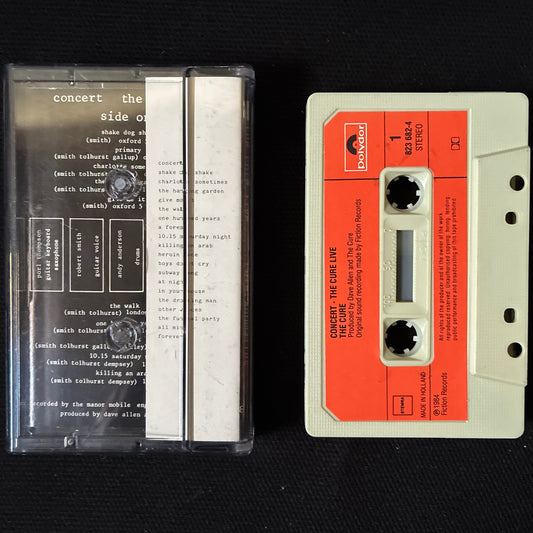 CURE - CONCERT (THE CURE LIVE) AND CURIOSITY (CURE ANOMALIES 1977-1984) (USED CASSETTE 1984 NETHERLANDS)