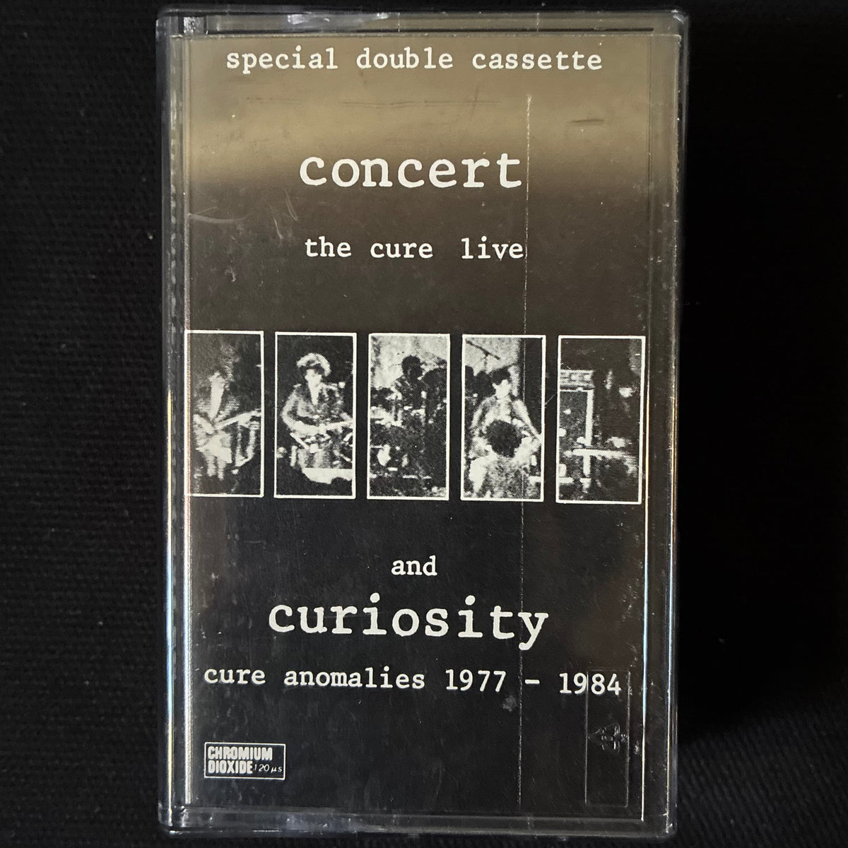 CURE - CONCERT (THE CURE LIVE) AND CURIOSITY (CURE ANOMALIES 1977-1984) (USED CASSETTE 1984 NETHERLANDS)